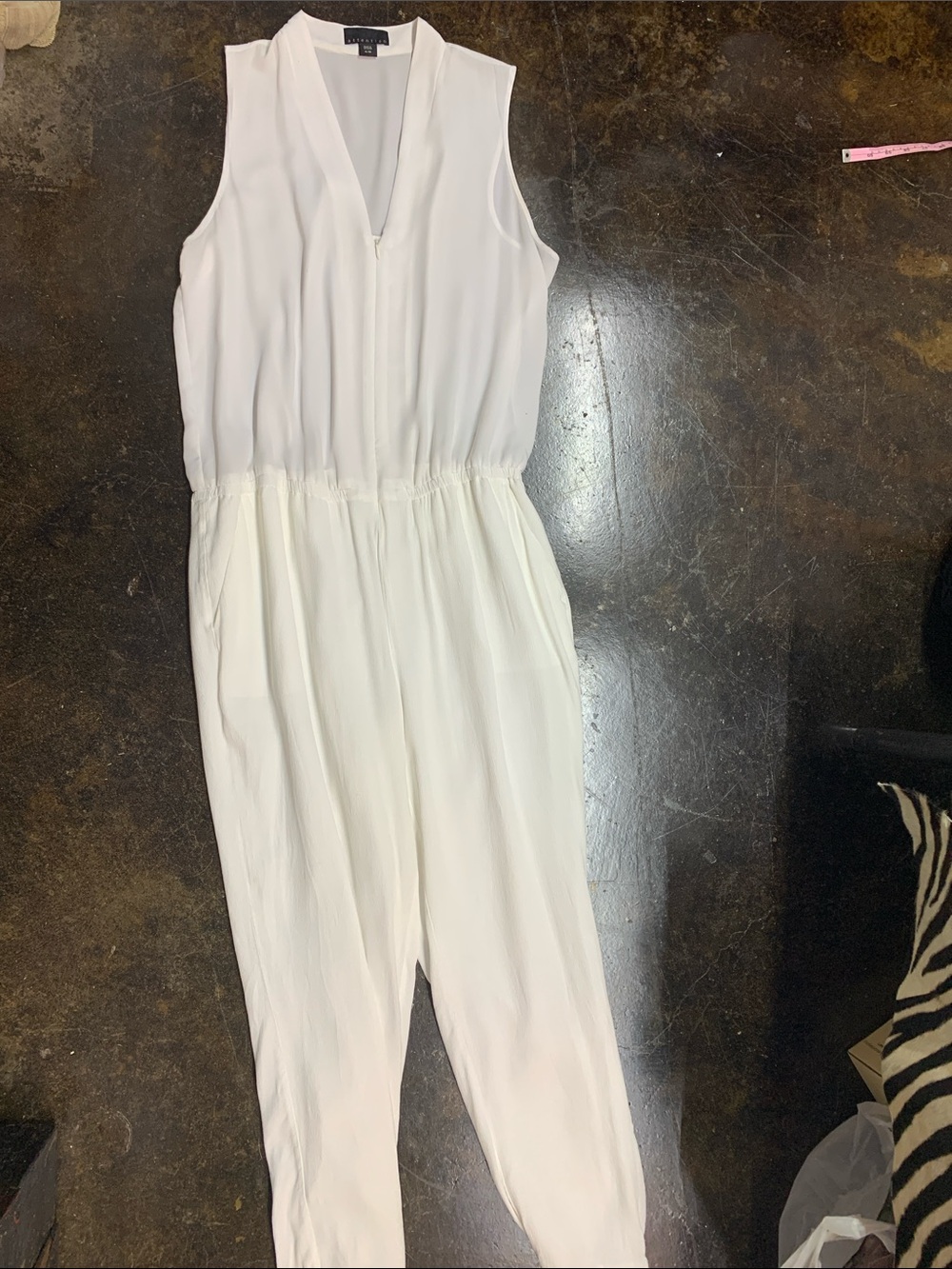 attention Sleeveless White V-Neck Jumpsuit